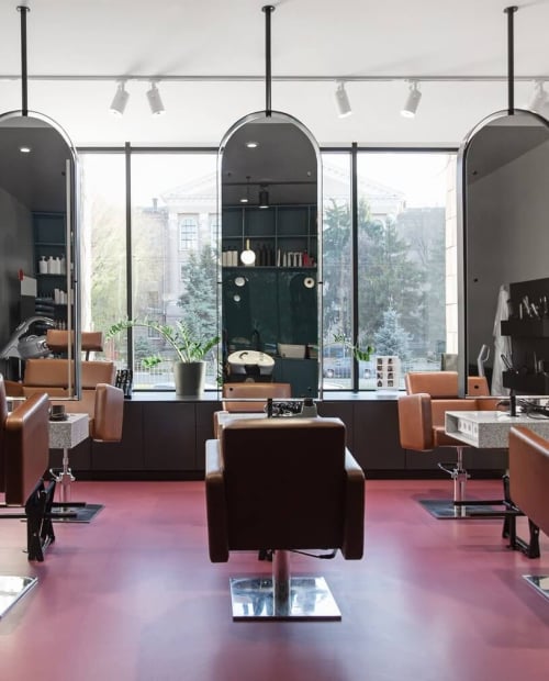 Chairs and mirrors in modern hairdressing, beauty salon
